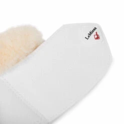 LeMieux Lambswool Overreach Boots -Equine Worlds lambswool bell boot white strap lemieux 73312.1638568731